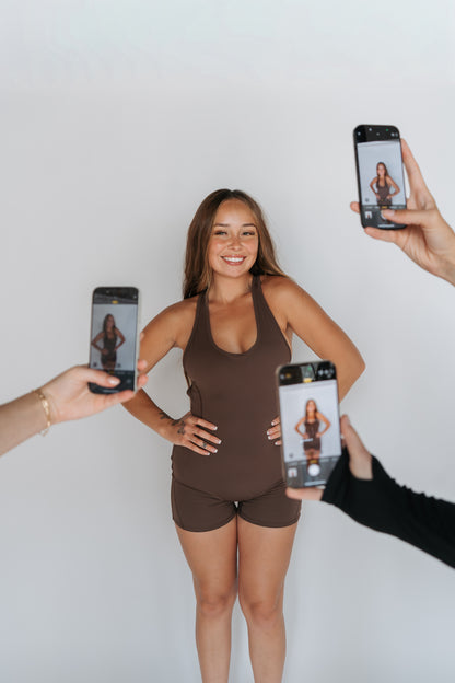 sweat societee malibu romper in dune. luxe athletic wear 